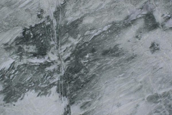 Acquatic Quartzite countertop featuring dynamic blue, grey, and green tones with dramatic patterns