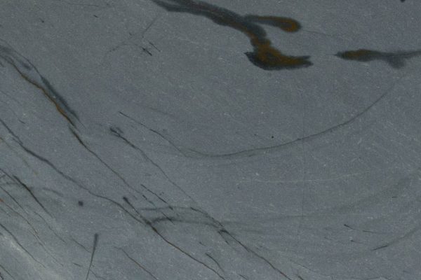 Blue Roma Quartzite countertop featuring blue and grey hues with gold and rust-colored veins
