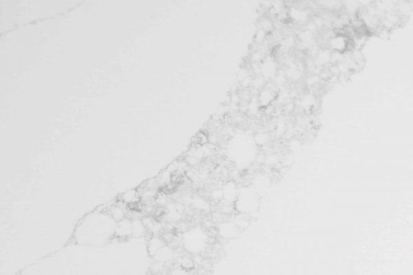 Calacatta Venice Quartz countertop featuring soft white background and intricate cloud-like grey veins