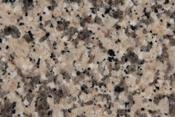 Crema Caramel Granite countertop showcasing caramel and beige tones with subtle brown and black specks