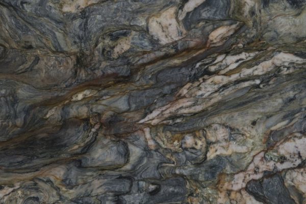 Fusion Quartzite countertop featuring dramatic blue, grey, gold, and earthy toned patterns