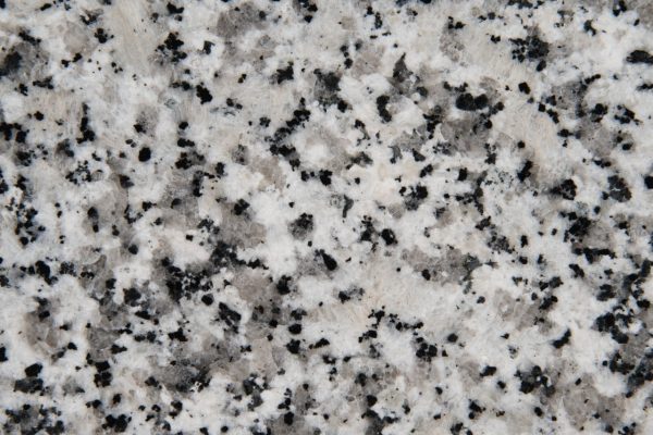 Luna Pearl Granite countertop featuring white, grey, and black specks
