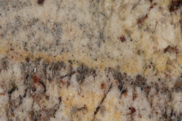 Typhoon Bordeaux Granite countertop featuring warm beige, rich burgundy, and elegant grey patterns