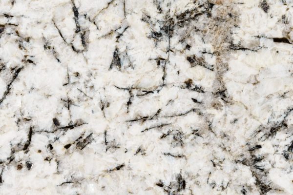White Glimmer Granite countertop featuring radiant white tones with black and grey accents