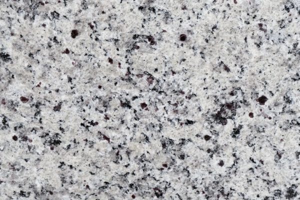 White Napoli Granite countertop featuring crisp white and grey tones with subtle black specks
