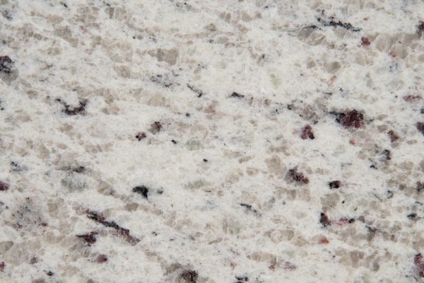 White Ornamental Granite countertop featuring white and creamy tones with grey and burgundy accents