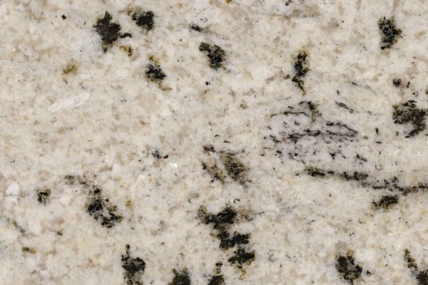 White Storm Granite countertop featuring a striking white background with bold black and grey flecks